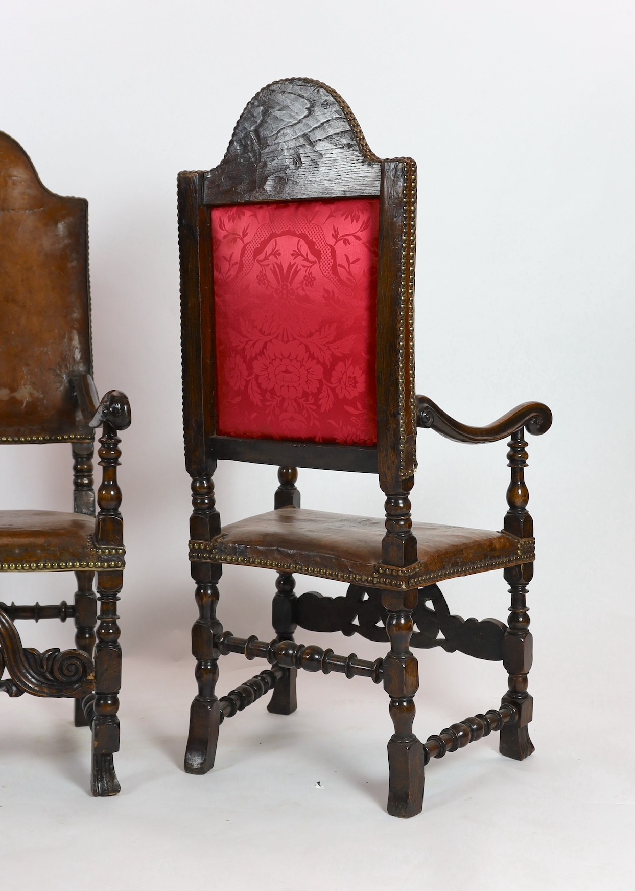 A pair of late 17th century Spanish walnut and elm armchairs, width 69cm, depth 61cm, height 141cm